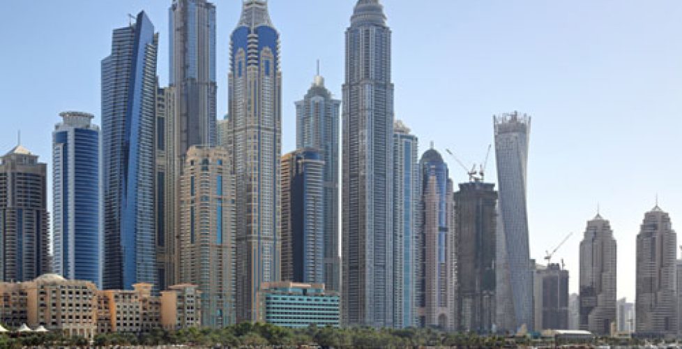 Picture of very tall building in Dubai by the water