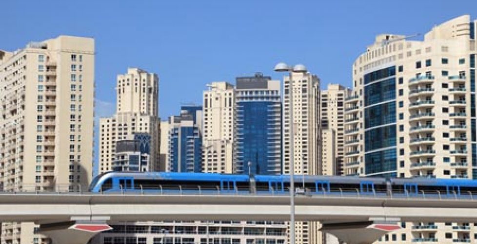 Picture of the Dubai metro and the houses behind it