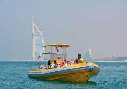 A yellow rubber sightseeing boat in front of Burj Al Arab