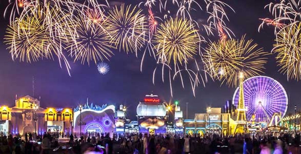 Night image of the Global Village Dubai with firework