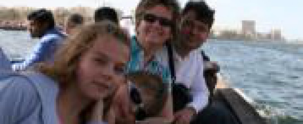 Kovi Robert ajanlas Picture of a family sitting on a traditional boat