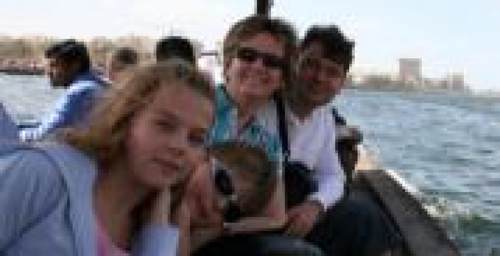 Picture of a family sitting on a traditional boat