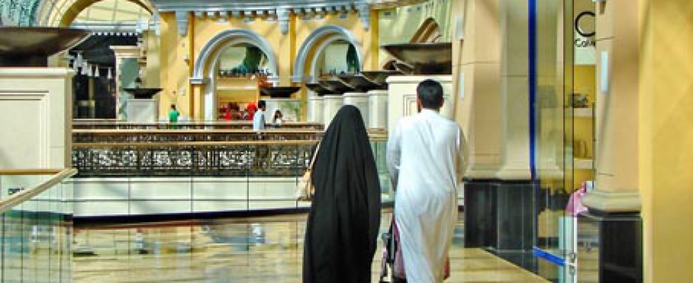 A couple is walking in a shopping mall in Dubai