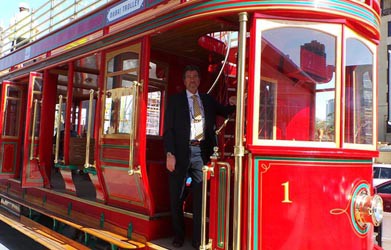 Hydrogen powered red double-decker tram on the streets of Dubai