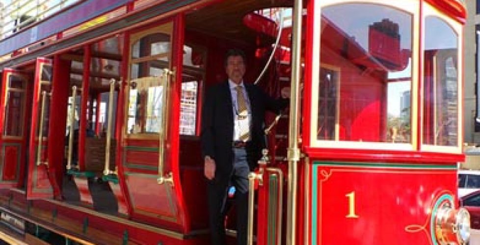 Hydrogen powered red double-decker tram on the streets of Dubai