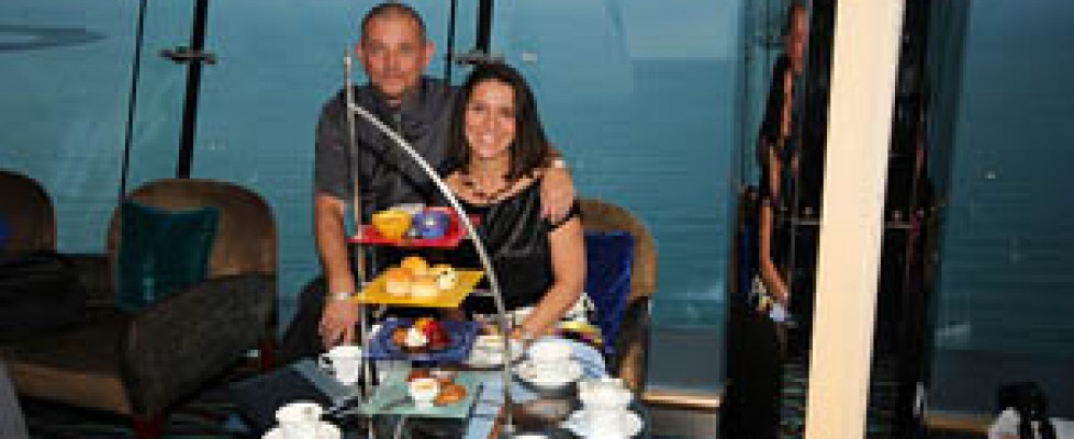 A couple is eating high tea in a hotel