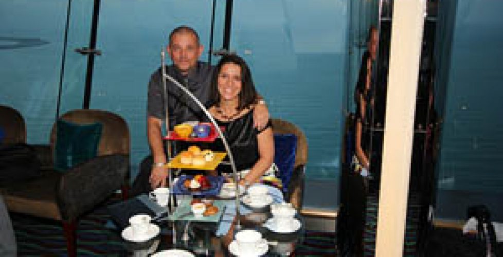 A couple is eating high tea in a hotel