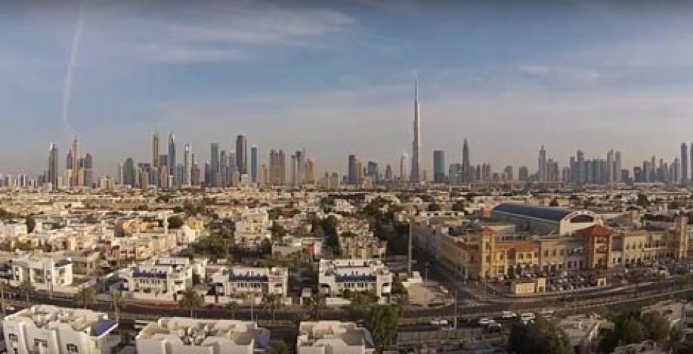 Suburb of Dubai with Burj Khalifa in background photographed from air