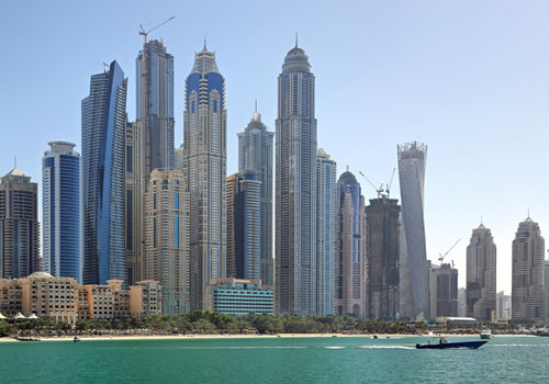 Picture of very tall building in Dubai by the water