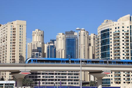 Picture of the Dubai metro and the houses behind it