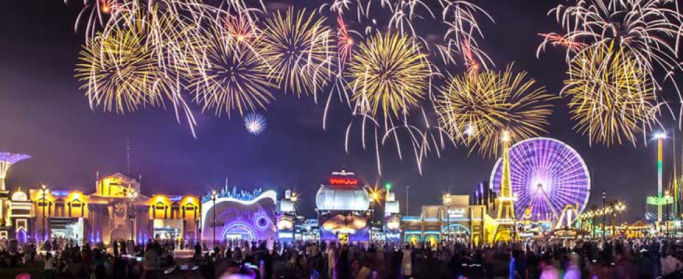 Night image of the Global Village Dubai with firework