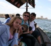 Kovi Robert ajanlas Picture of a family sitting on a traditional boat