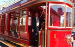 Hydrogen powered red double-decker tram on the streets of Dubai