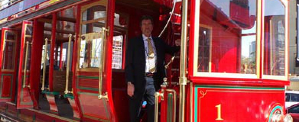 Hydrogen powered red double-decker tram on the streets of Dubai