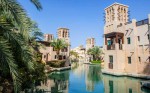 Houses standin along a water channel in Dubai