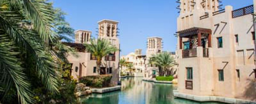 Houses standin along a water channel in Dubai