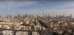 Suburb of Dubai with Burj Khalifa in background photographed from air