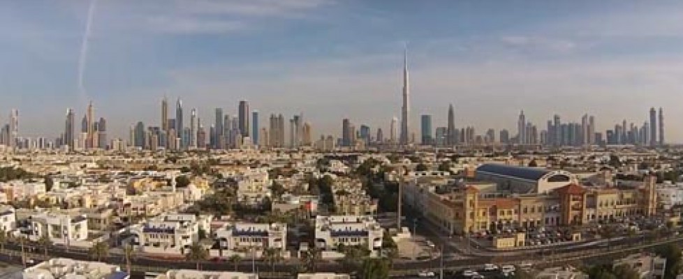 Suburb of Dubai with Burj Khalifa in background photographed from air